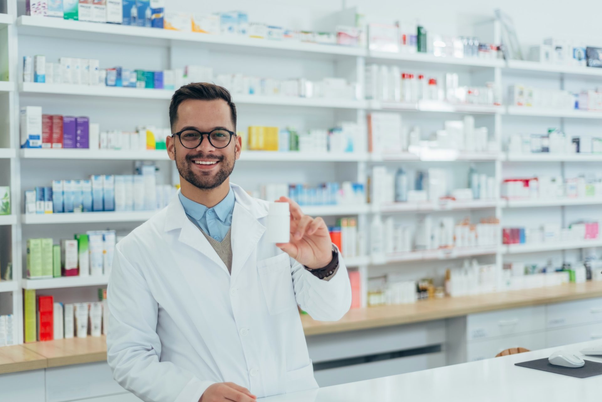Portrait of a handsome pharmacist working in a pharmacy