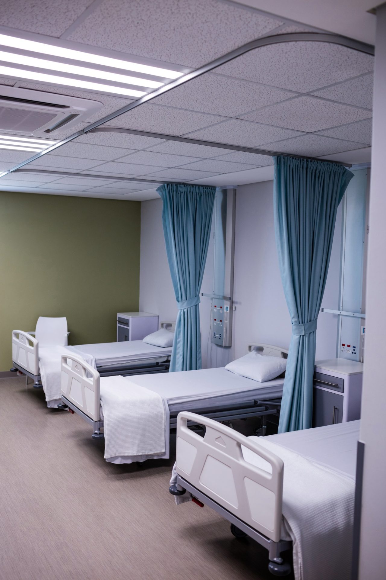 View of empty hospital beds in ward